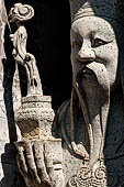 Bangkok Wat Arun - Details of the statues of Chinese saints of the pagoda at the corners of the Ubosot coutyard. 